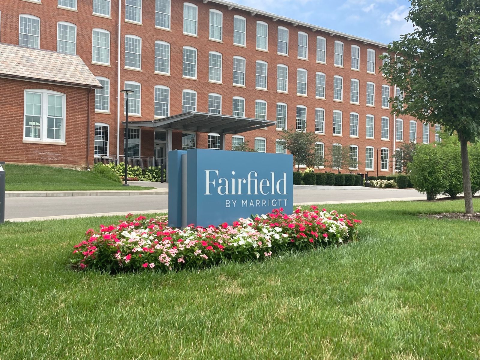 Fairfield hotel sign with brick building background.
