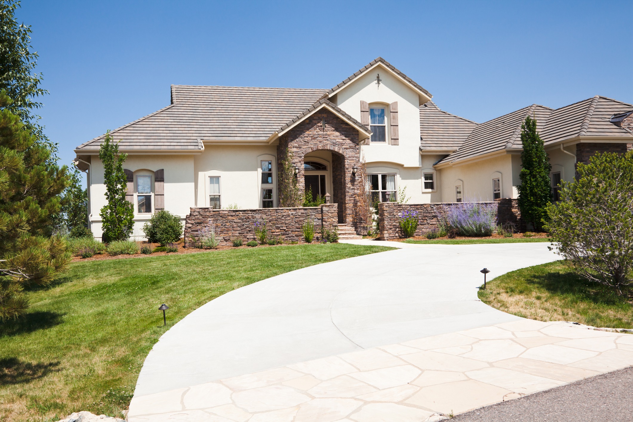 Modern suburban house with manicured lawn