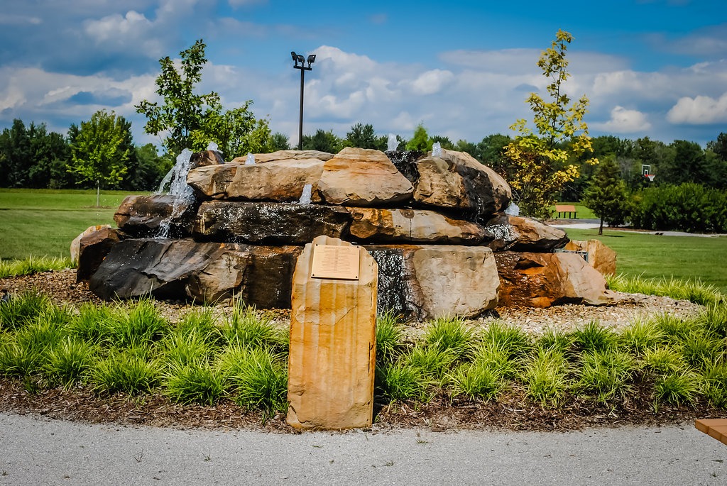 Rock water feature in a park landscape.