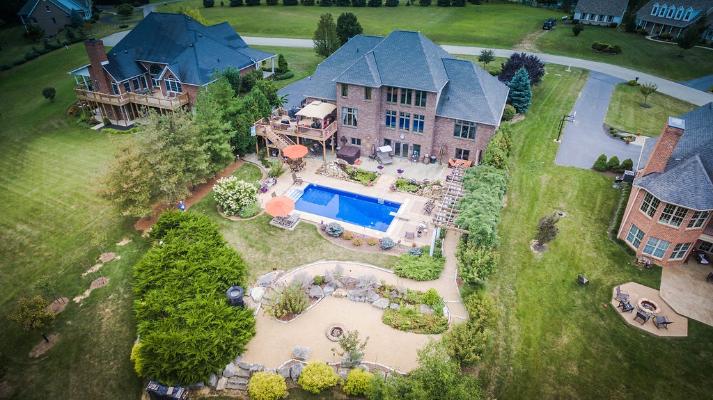 Aerial view of luxurious house with pool